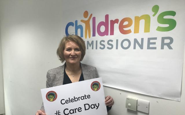 Anne Longfield the Children's Commissioner for England holds a placard saying Celebrate Care Day