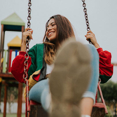 foster child on park swing