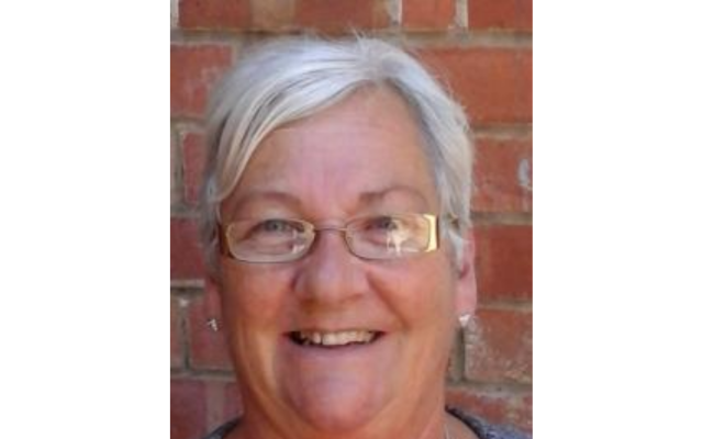 woman smiling with glasses