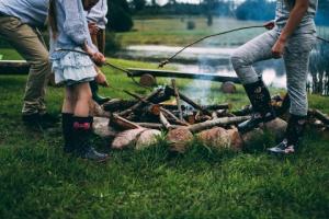 foster children around a fire pit