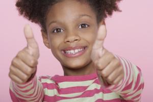 foster child with thumbs up