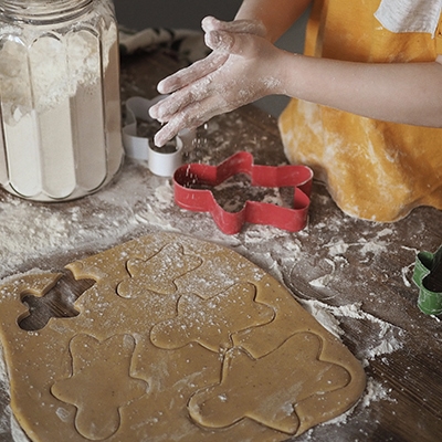 child in temporary foster care baking cookies