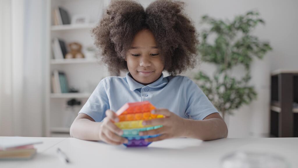 Child playing with sensory toy 