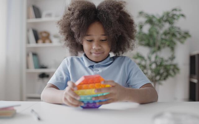 Child playing with sensory toy