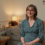 woman sat on chair in living room