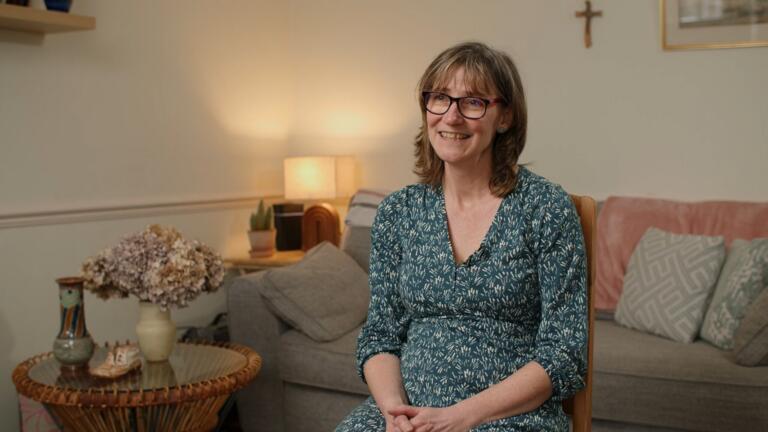 woman sat on chair in living room